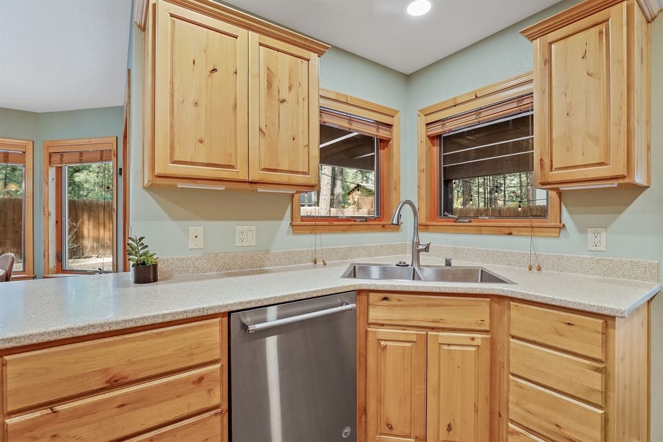 Featuring stainless steel appliances, a dishwasher, and all the essentials needed for home-cooked meals