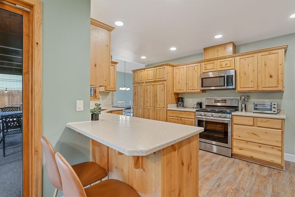 Bright and contemporary kitchen with a spacious counter, perfect for cooking and entertaining