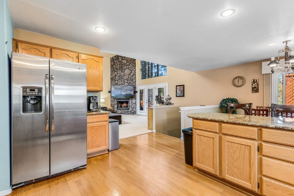Open floor plan to living and dining room, and stairs leading to game room.