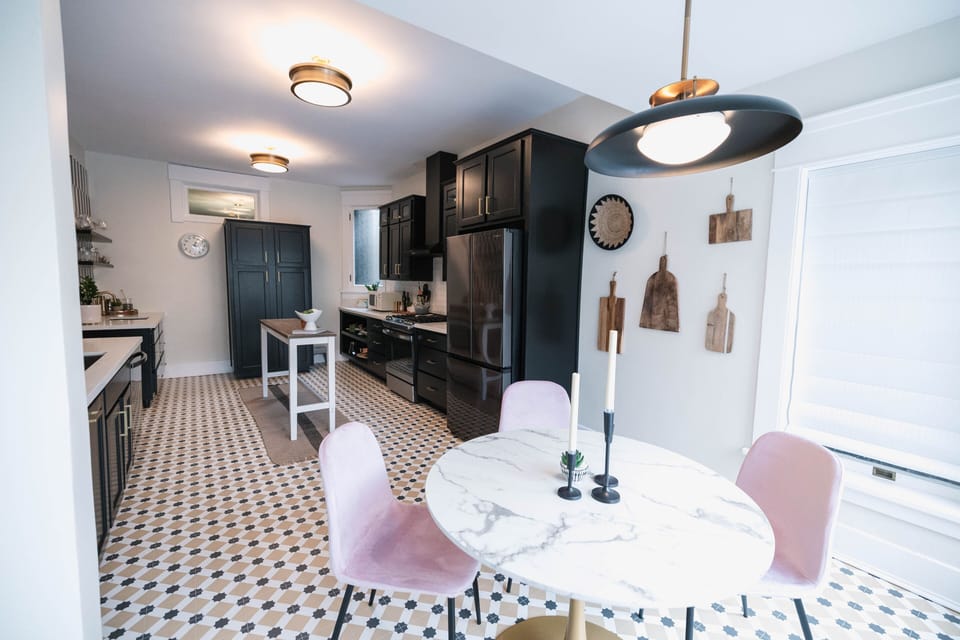 Gather around the elegant dining table, perfect for enjoying meals together. This charming space is ideal for family dinners or a quiet meal with loved ones, combining historical style with modern comfort.