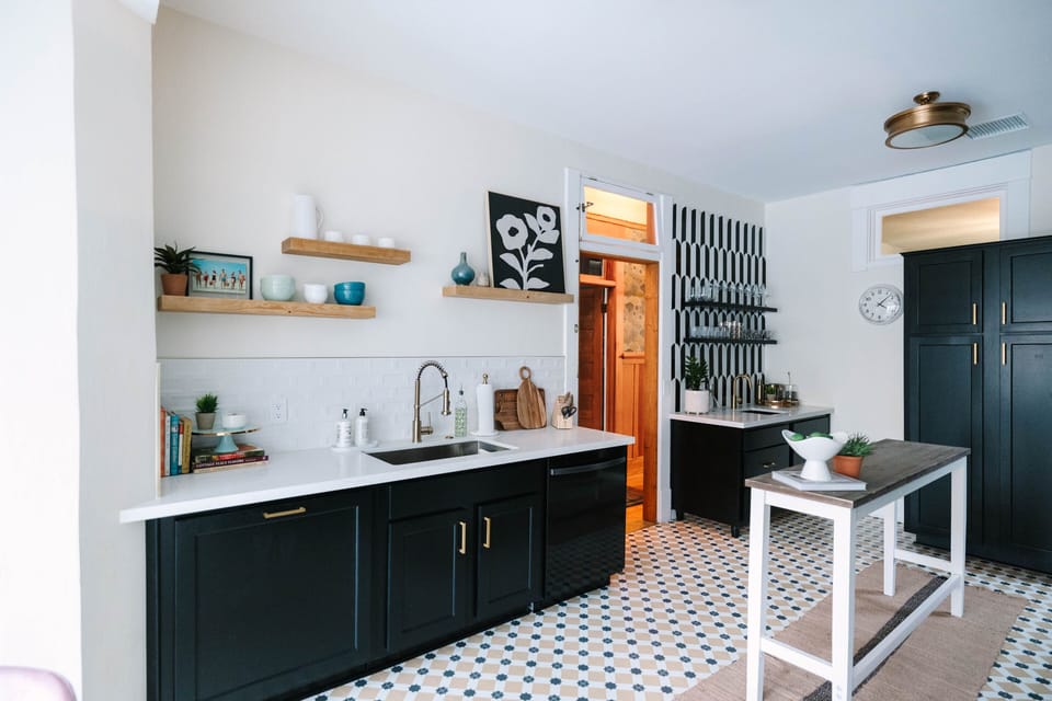Fully equipped kitchen with brand-new stainless steel appliances, including a stove, oven, microwave, refrigerator, and dishwasher.