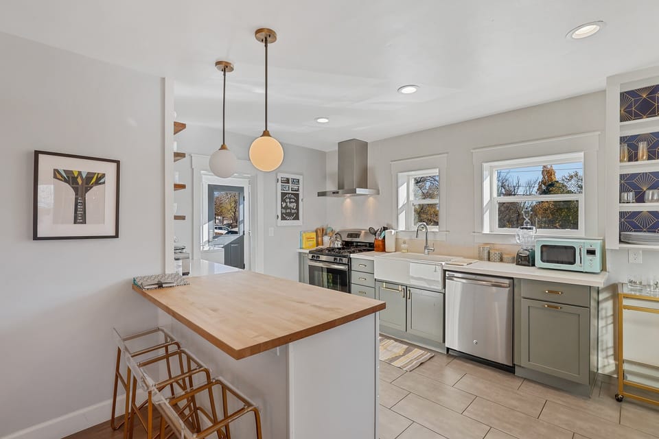 The kitchen and dining area at The Downtown Crown are designed to bring people together, combining functionality and modern elegance.