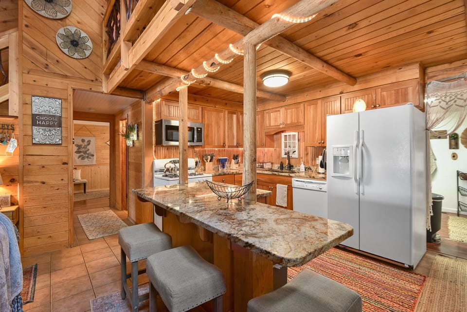 The kitchen island also features 3 bar stools for casual dining options.
