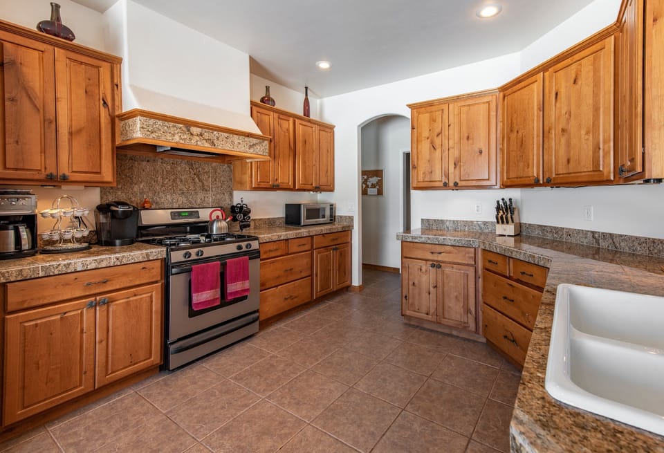 Fully Equipped Kitchen: Granite countertops, a gas range, Keurig and standard coffee makers, and top-notch cookware for home chefs.