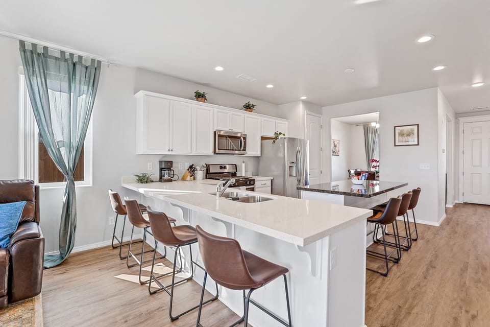 Fully Equipped Kitchen & Dining: Cook for your crowd with ease using stainless steel appliances, a slow cooker, and a stocked pantry area.