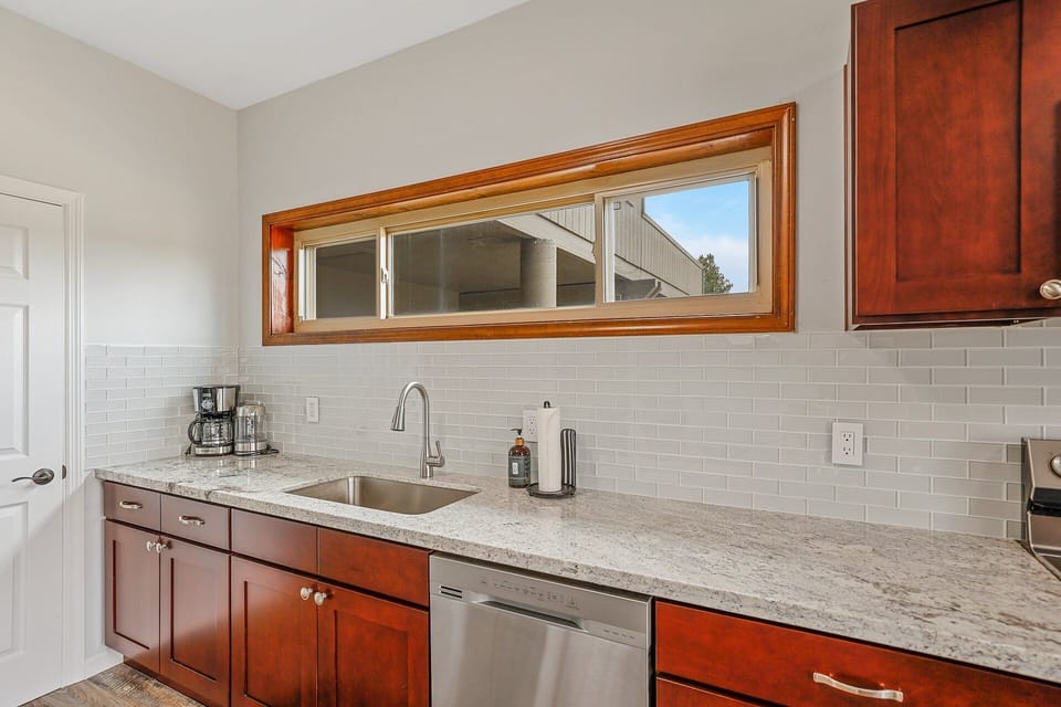 Cook your favorite meals in the fully equipped kitchen with new appliances and all essentials. Enjoy your meals at the dining table or on the private deck.