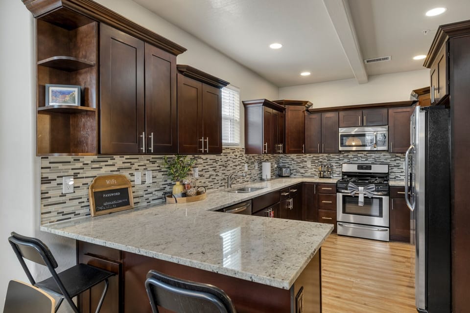 Fully Equipped Kitchen: New stainless steel appliances, granite countertops, and all the essentials