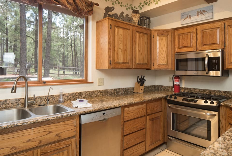 Stocked with upgraded countertops, stainless steel appliances, and everything you need to prepare meals for the group.
