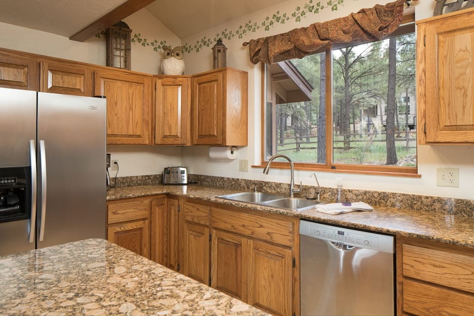 Create meals with ease using stainless steel appliances, oak cabinetry, and plenty of preparation space.
