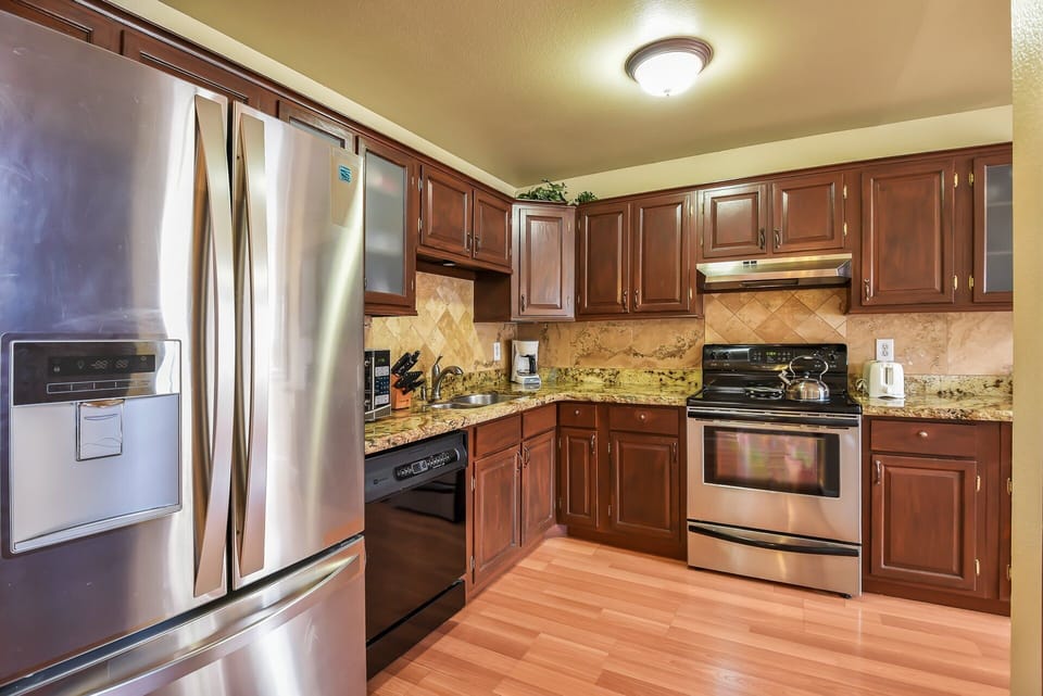 Fully Equipped Kitchen: Granite countertops, premium appliances, and everything you need to whip up a feast.