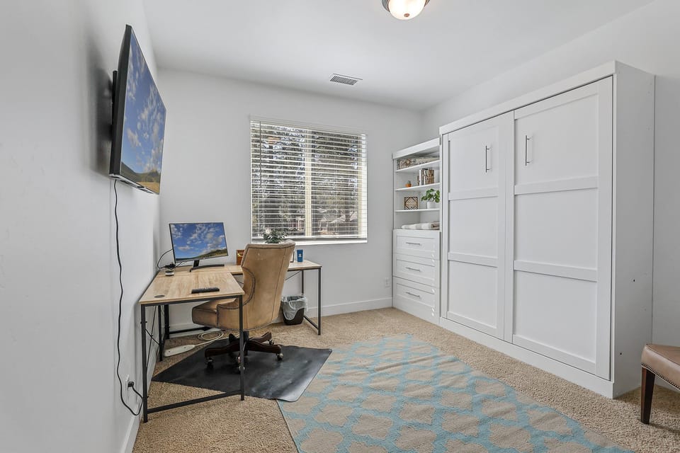2nd Floor - Bedroom 5/Office Combo: Queen Murphy Bed and workspace with monitor and smart TV