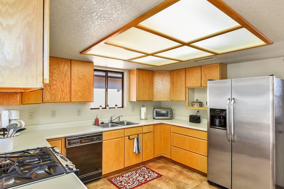 The fully equipped kitchen features modern appliances and everything you need to whip up hearty meals.