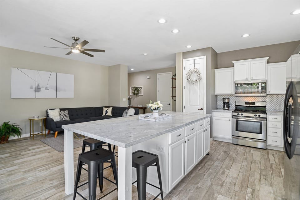 The dining area at the large kitchen island has plenty of seating for all.