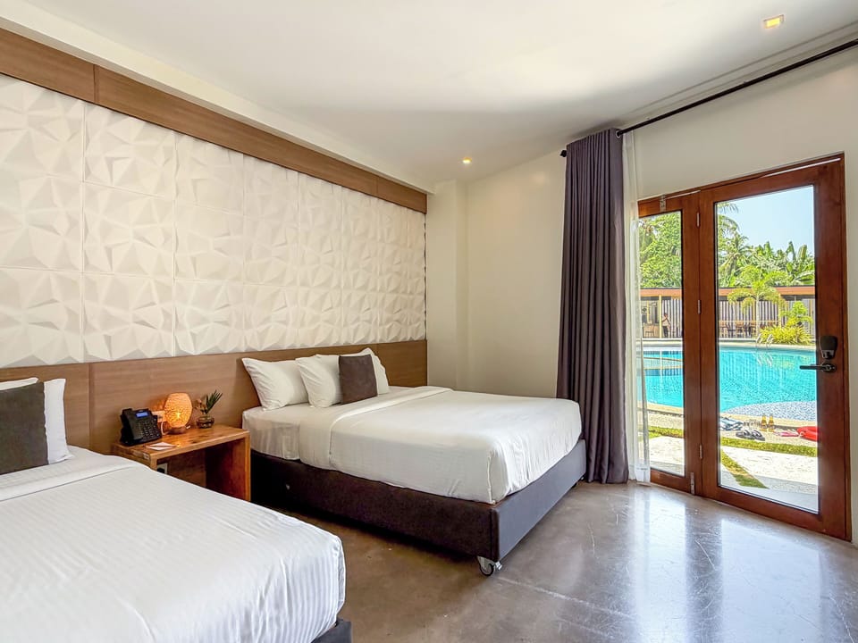 Deluxe Triple Room, Pool Access | Desk, free WiFi