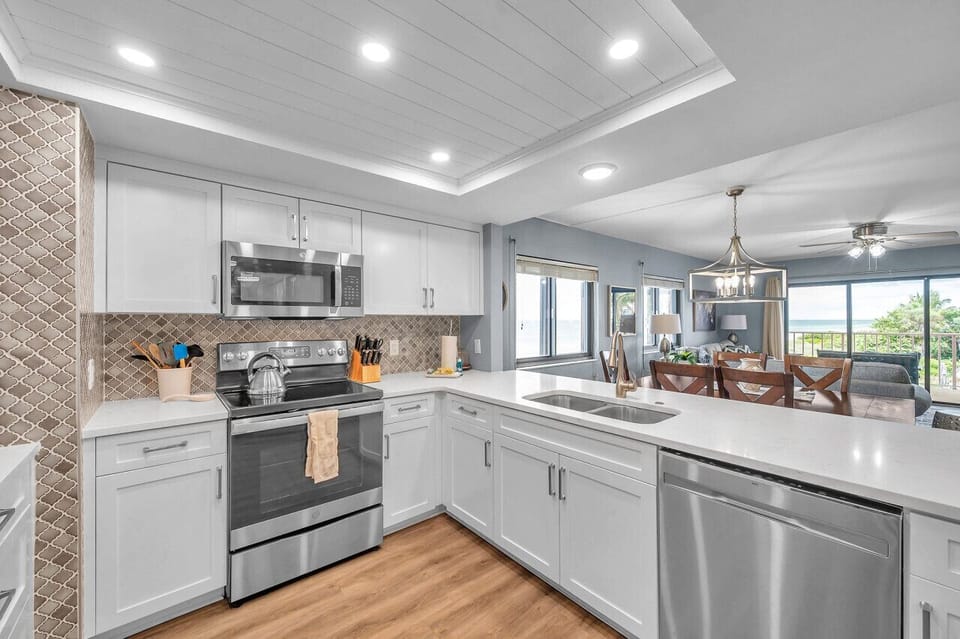 Modern kitchen w/ stainless steel appliances, ample counter space & an open layout for easy cooking.