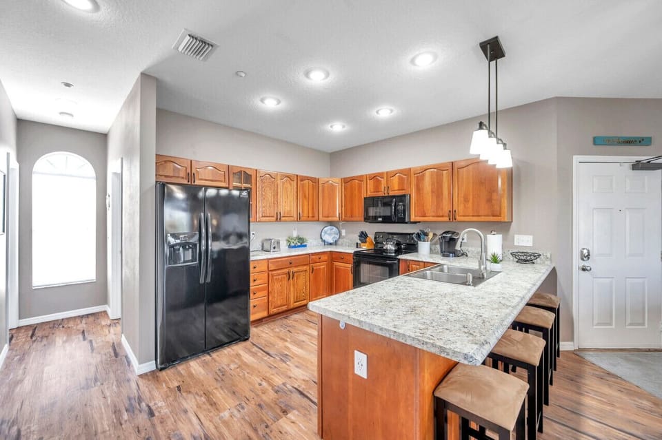 Open kitchen layout w/ ample counter space and a smooth flow into the living areas