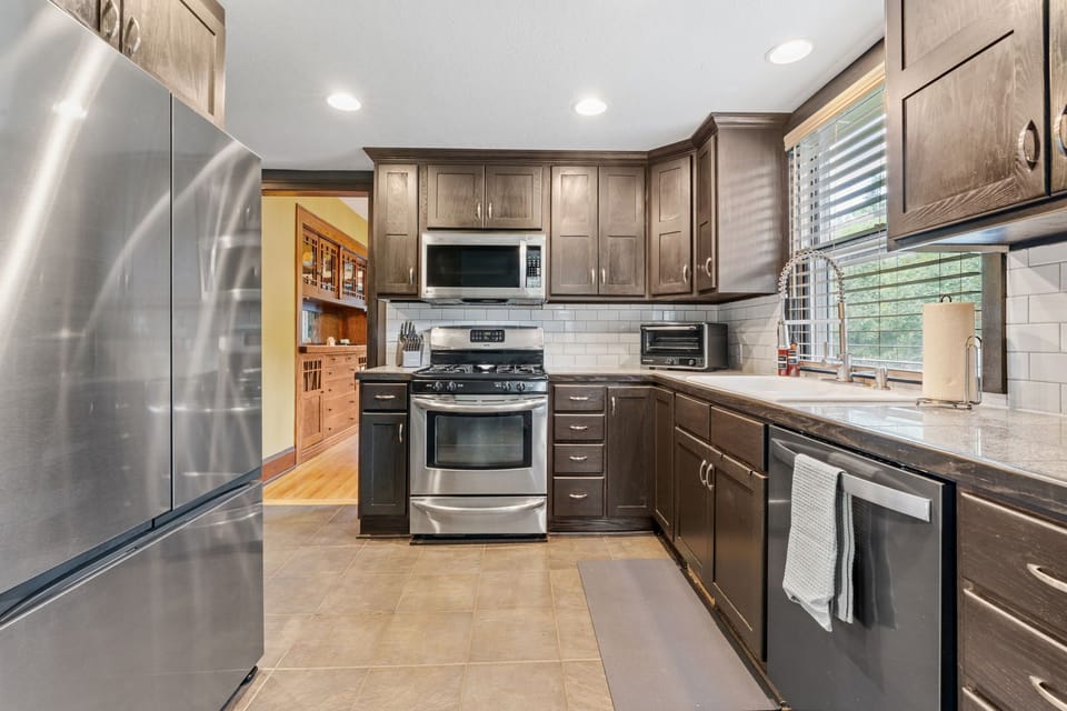 Your fully equipped kitchen awaits with stainless steel appliances, granite counters, and everything you need to create memorable meals during your stay.