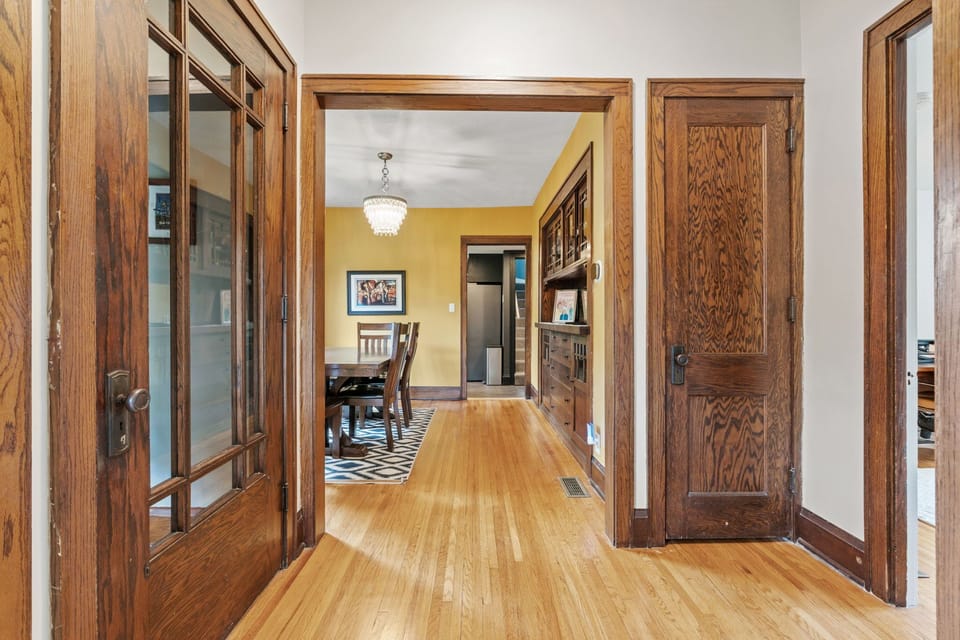 Step into your elegant retreat where gleaming hardwood floors and rich wood trim create warmth throughout your spacious home.