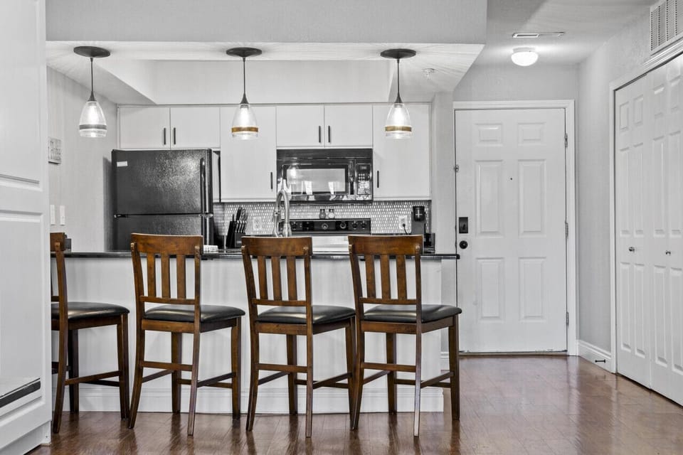 The open kitchen with bar seating makes it easy to cook, snack, and stay connected with your group.