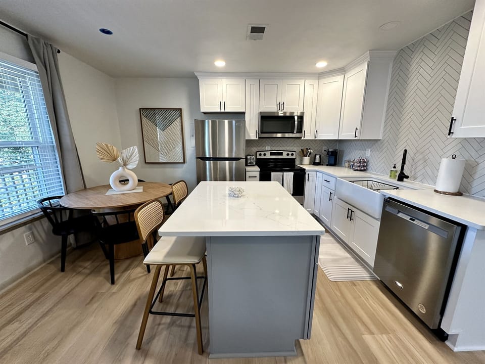 kitchen island and seating for 4 at the dining table.