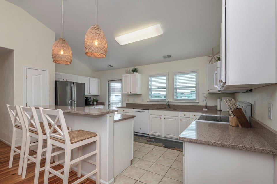 Kitchen area with Breakfast Bar and acces to Deck!