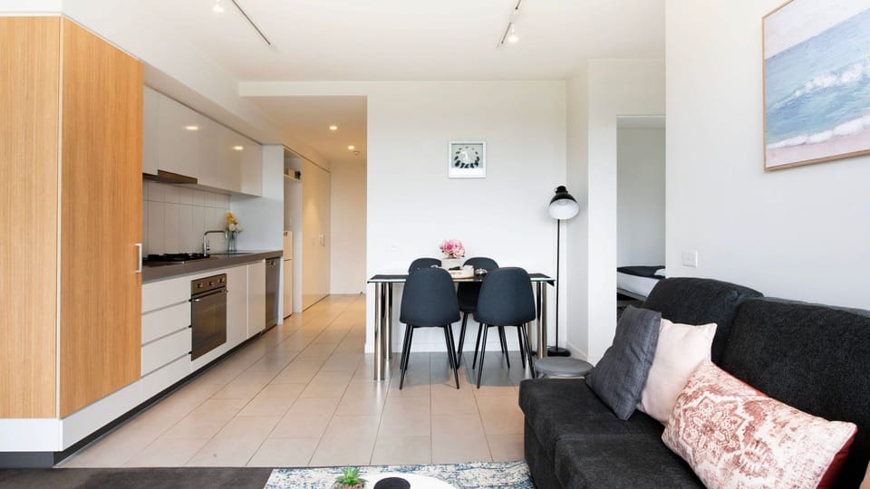 Spacious open-concept layout blending modern kitchen elegance with cozy living charm.