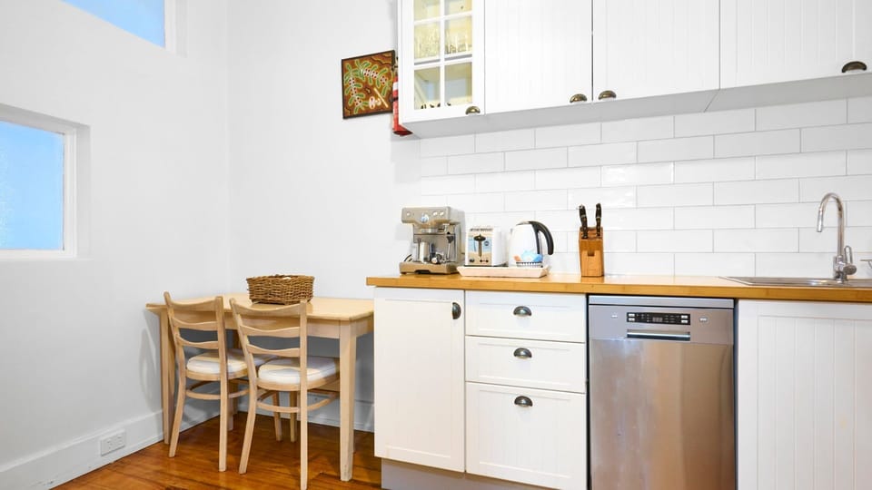Enjoy casual meals in a smartly designed kitchen space that flows seamlessly into a cozy dining nook.