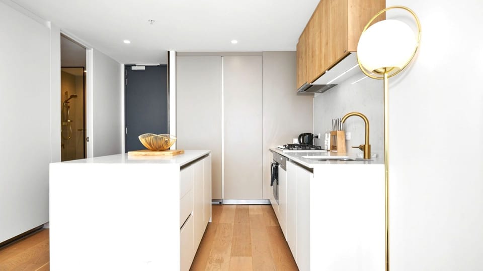 Elegant designer kitchen with minimalist styling and premium finishes.