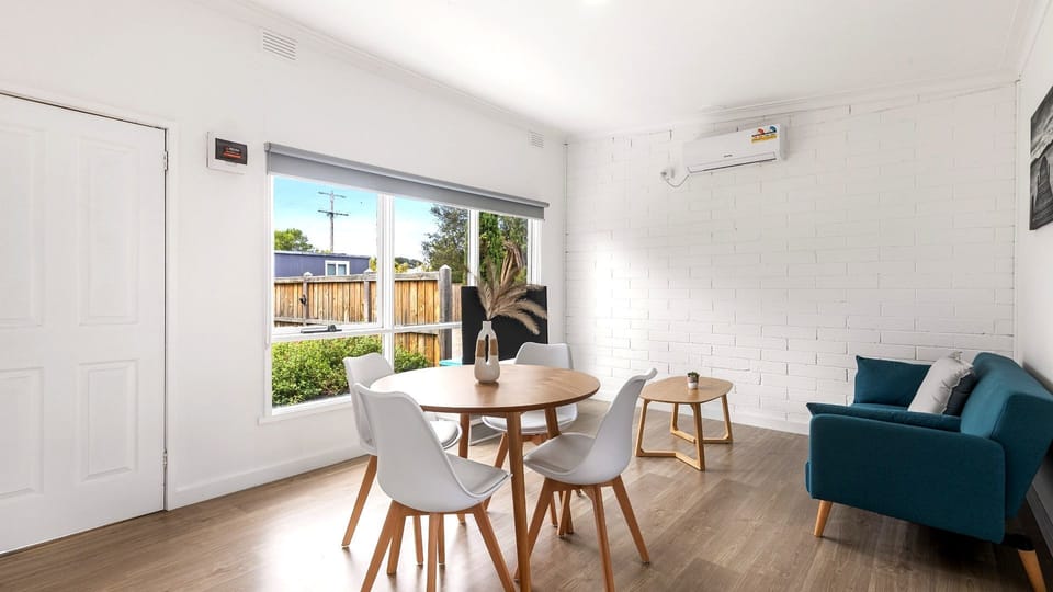 Start your morning with coffee or gather for dinner in this bright dining space overlooking the garden.