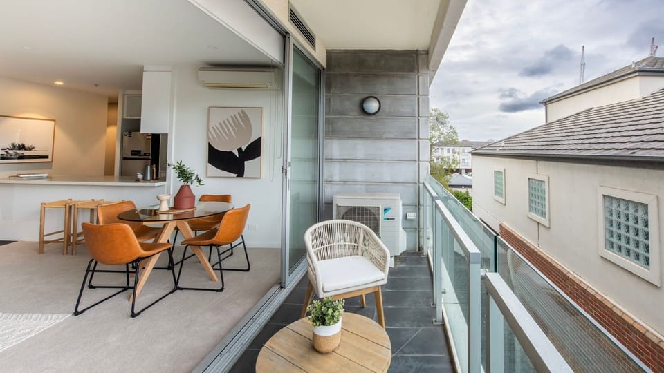 Enjoy your morning coffee or evening drinks on the balcony with a peaceful suburban backdrop.