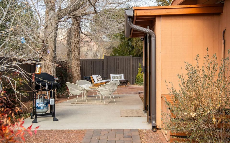 Gather around the fire pit, fire up the grill, and enjoy this cozy patio space under the trees. Whether it's morning coffee or evening s’mores, this inviting outdoor area is made for memorable moments with friends and family.