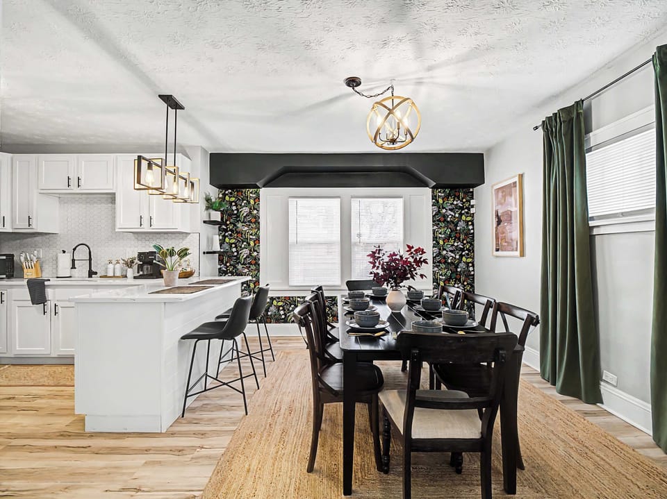 Light-filled dining area beside the kitchen w/ table for shared meals & easy conversation