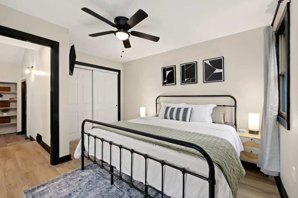 Bright bedroom w/ clean lines, soft bedding & a calm, modern feel