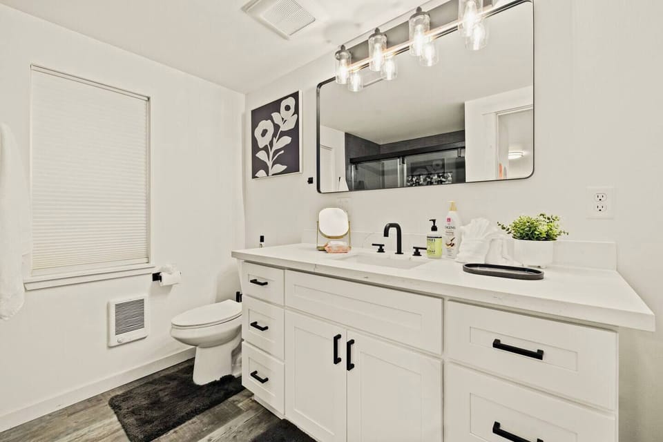 Bathroom #1 is downstairs and has a shower area with sliding doors. Comes fully stocked with high quality body wash, shampoo, and conditioner