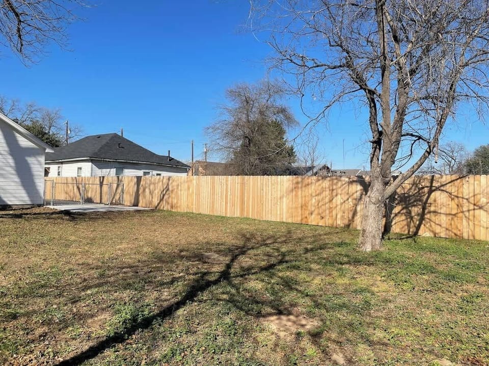 Backyard accessible to driveway. Fully fenced for privacy. 
