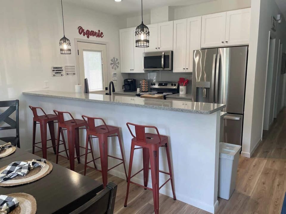 Open concept kitchen, dining, living room. 