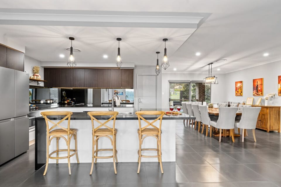 Have a few drinks at the kitchen island while watching the designated chef in action.