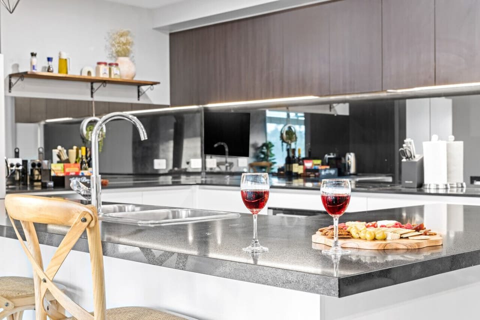 Have a few drinks at the kitchen island while watching the designated chef in action.