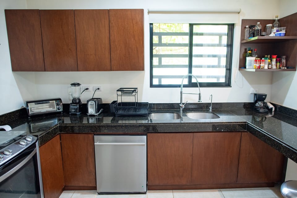 The very large kitchen is the dream of any passionate Chef, offering all the needed amenities and electrodomestics, including a dishwasher, a gas powered  5 burners stove with oven, a water purifying System and plenty of cupboards and storage spaces.