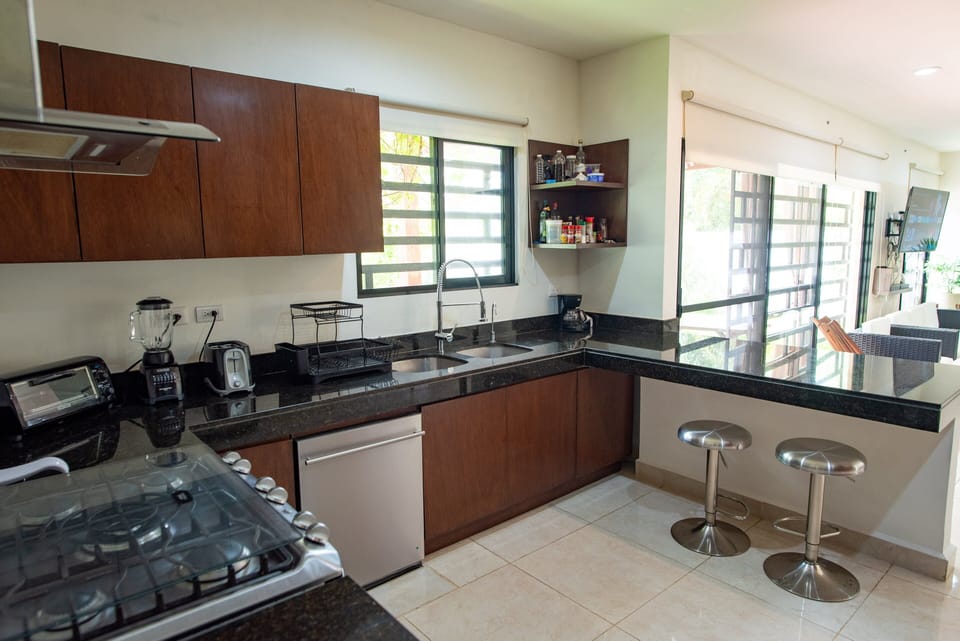 The very large kitchen is the dream of any passionate Chef, offering all the needed amenities and electrodomestics, including a dishwasher, a gas powered  5 burners stove with oven, a water purifying System and plenty of cupboards and storage spaces.