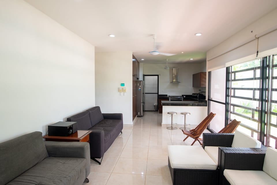 The living and sitting area is very spacious and offer comfortable sofas, some being sofa-beds for eventual sleep over visitors, plenty of floor to ceiling windows and garden view.