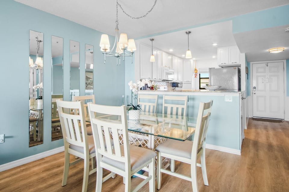 Stylish dining area seats six, perfect for family gatherings.