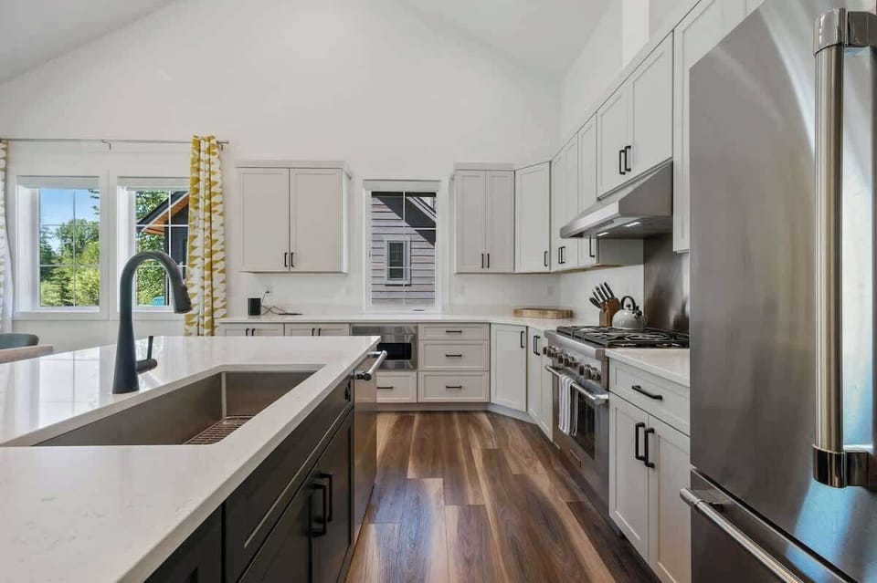 Sleek, spacious kitchen with stunning stainless steel appliances—made to impress and built to entertain.