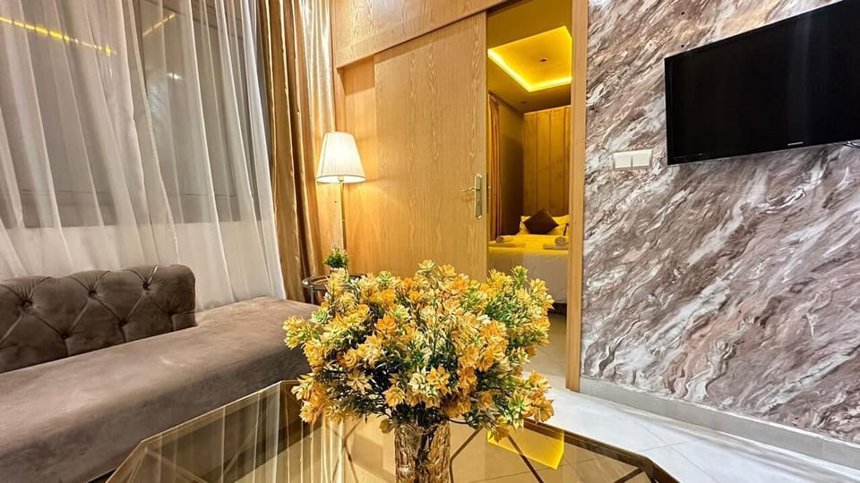 Family Apartment | Living area | 42-inch Smart TV with digital channels, streaming services
