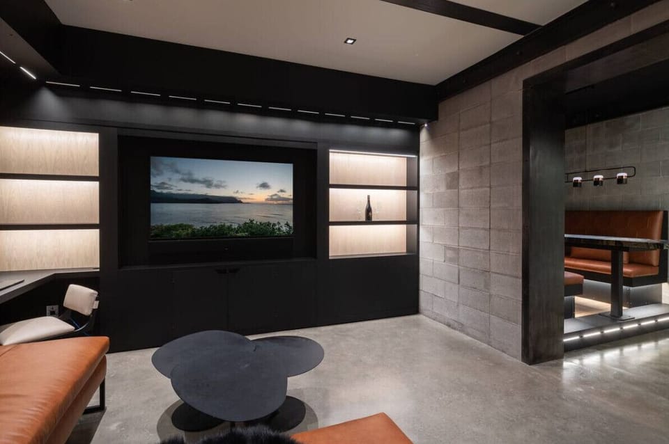 RH | Kick back and enjoy movie nights or your favorite shows in this sleek, modern entertainment room.