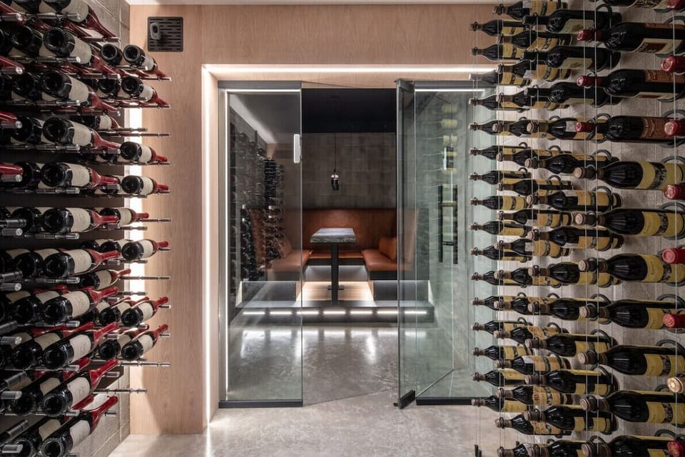 RH | Visually stunning wine cellar. **Note: Guests do not have access to the interior of the cellar**