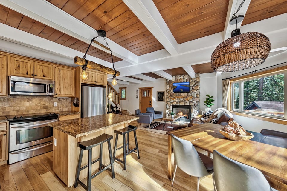 Your mountain retreat features soaring wood-beam ceilings, granite counters, and a crackling stone fireplace for perfect après-ski evenings.