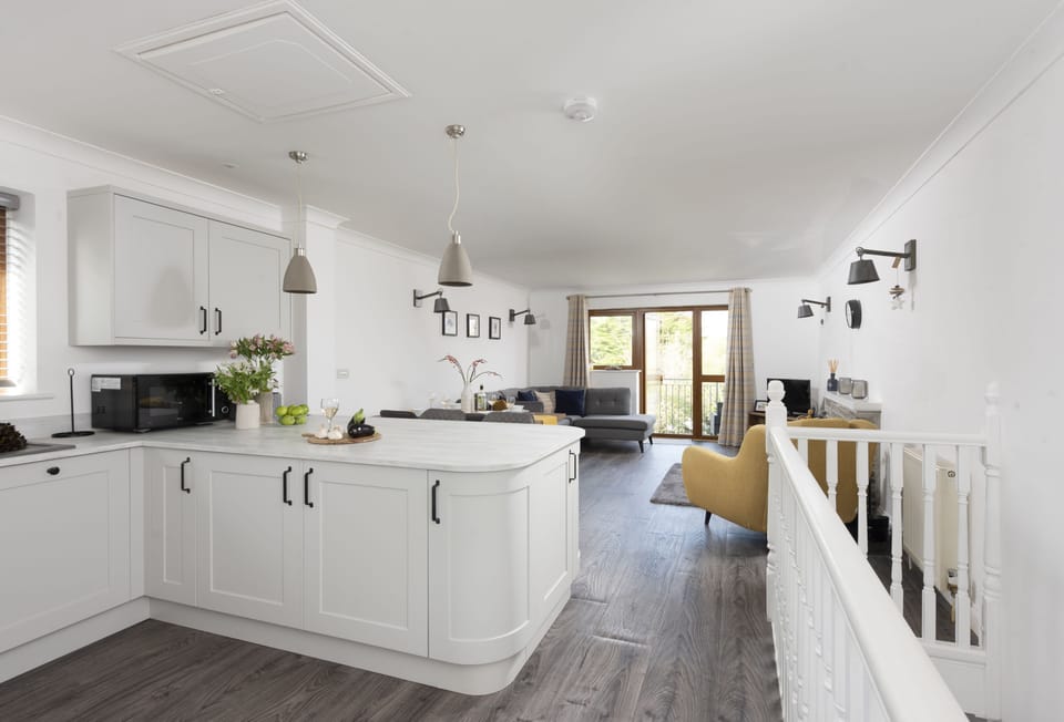 St Andrews, Polzeath. First floor: Retreat upstairs and fall in love with the spacious open plan living area