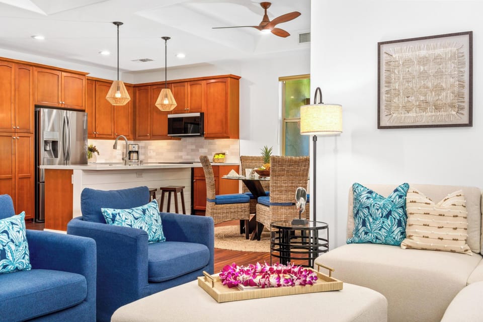 Spacious living room with vaulted ceilings and tall windows
