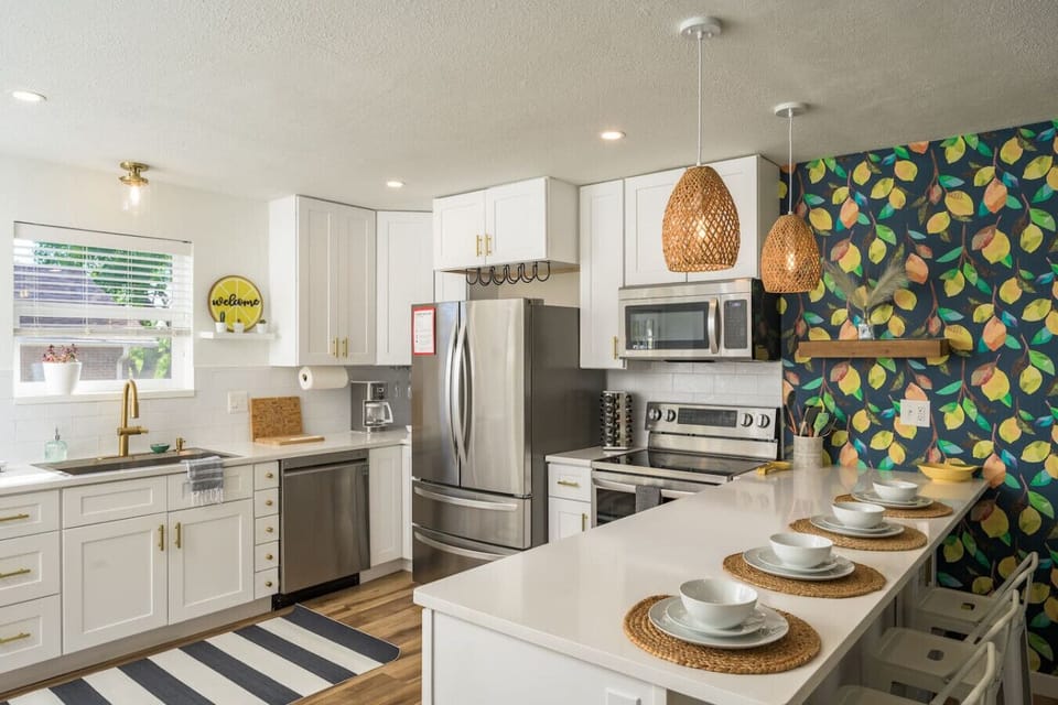 Bright kitchen with modern appliances and space to gather around the island.